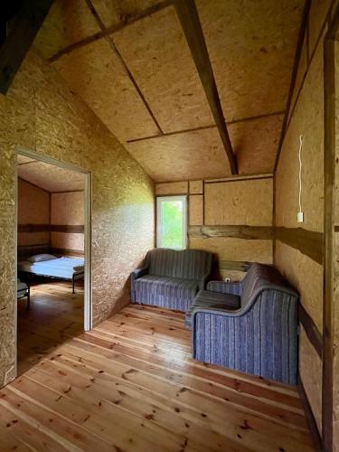 Ein Bett oder Betten in einem Zimmer der Unterkunft SŁOŃCE MAZUR