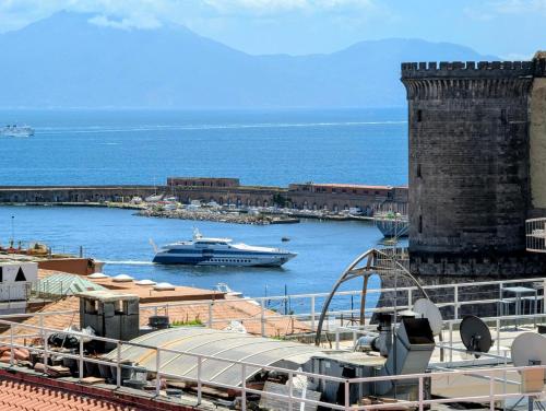 a boat in the water next to a harbor at Incoming Municipio in Naples