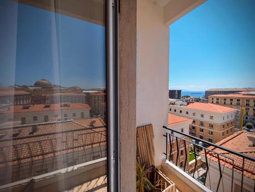 a balcony with a view of the city at Incoming Municipio in Naples