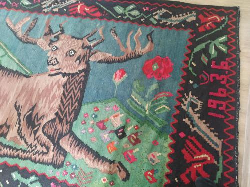 a rug with a picture of a cow on it at Vardzia Old Village in Vardzia