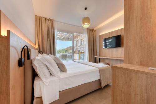 Postel nebo postele na pokoji v ubytování Cala Lupo Resort