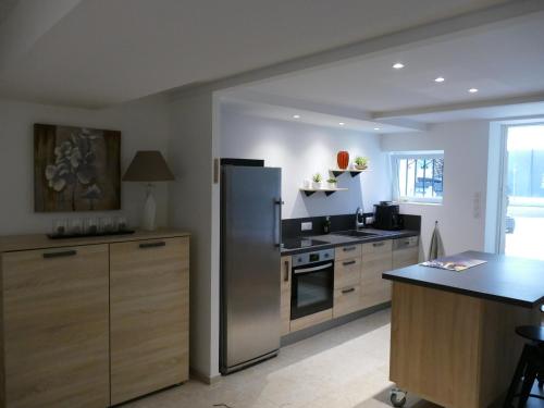 Køkken eller tekøkken på Appartement avec piscine privée