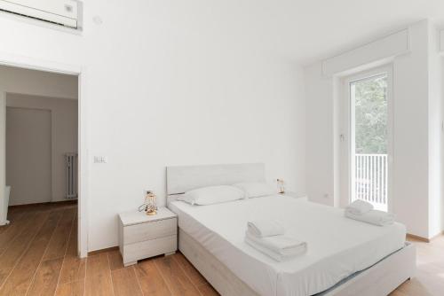 Postel nebo postele na pokoji v ubytování GuestHost - Bright & Comfy Apartment in Corvetto