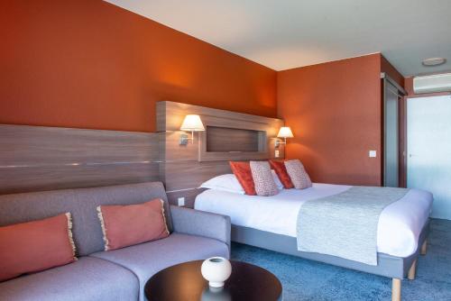Hôtel Beauregard, The Originals Relaisにあるベッド