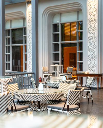 a group of tables and chairs on a patio at Taj Deccan in Hyderabad