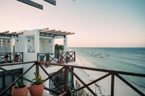 a view of the beach from a hotel balcony at ZAN Tropical Island in Bwejuu