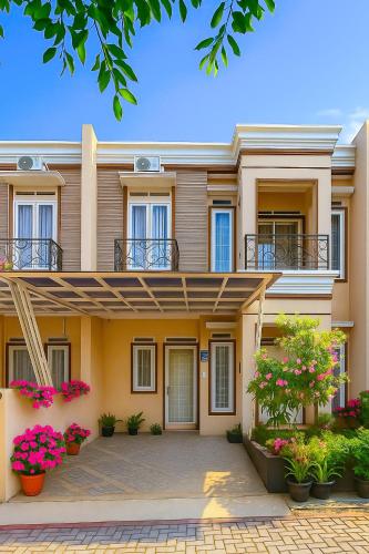 a house with flowers in front of it at The Villas in Bogor