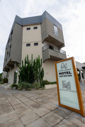 a hotel sign in front of a building at Plaza Hotel Sinop in Sinop