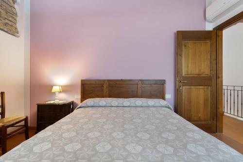 Ένα ή περισσότερα κρεβάτια σε δωμάτιο στο Agriturismo I Cipressi