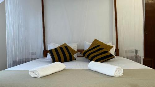 Ein Bett oder Betten in einem Zimmer der Unterkunft Wind Haven Yala