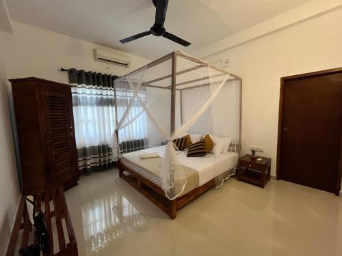 Ein Bett oder Betten in einem Zimmer der Unterkunft Wind Haven Yala