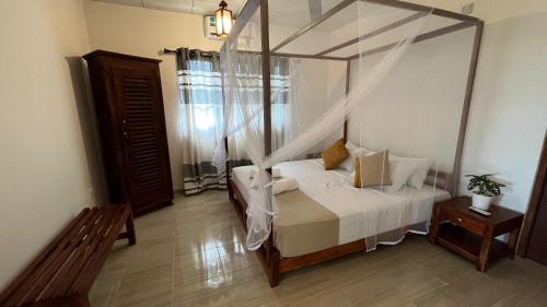 Ein Bett oder Betten in einem Zimmer der Unterkunft Wind Haven Yala