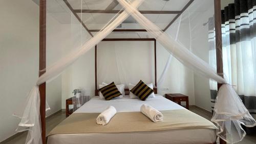 Ein Bett oder Betten in einem Zimmer der Unterkunft Wind Haven Yala