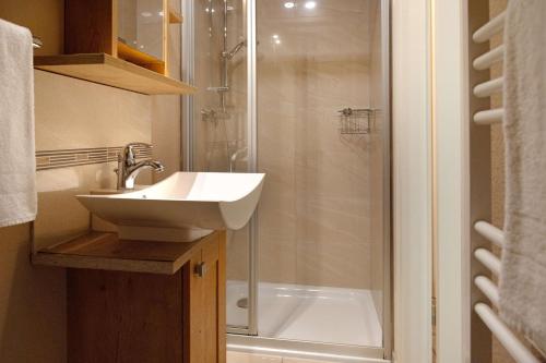 a bathroom with a sink and a shower at Fernweh in List