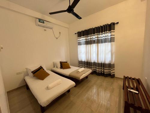 Ein Bett oder Betten in einem Zimmer der Unterkunft Wind Haven Yala