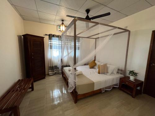 Ein Bett oder Betten in einem Zimmer der Unterkunft Wind Haven Yala