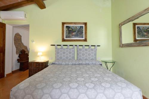 Ένα ή περισσότερα κρεβάτια σε δωμάτιο στο Agriturismo I Cipressi