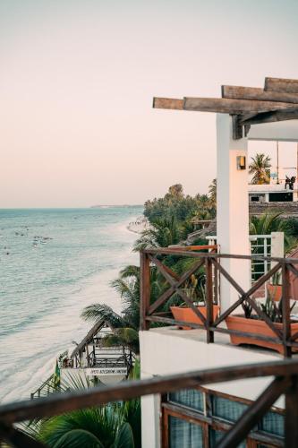 a view of the beach from the balcony of a resort at ZAN Tropical Island in Bwejuu