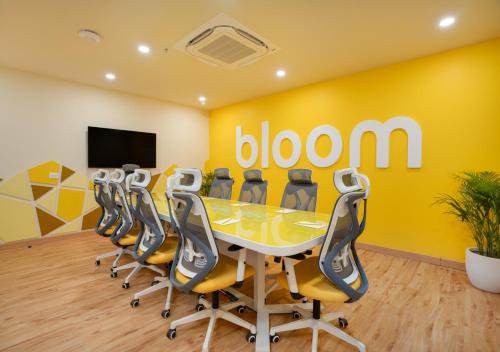 a conference room with a table and chairs at Bloom Boutique l Sector 45 Gurugram in Gurgaon