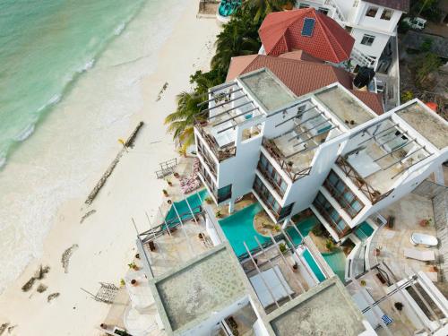 an aerial view of a hotel on the beach at ZAN Tropical Island in Bwejuu
