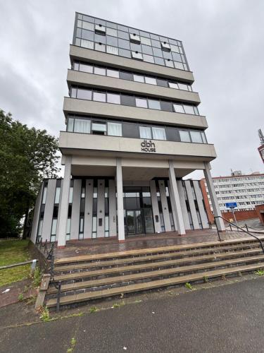 a tall building with steps in front of it at Carlton Square Luxury Apartments in Nottingham
