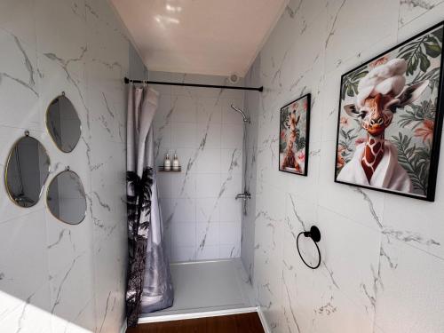 a bathroom with a shower with a shower curtain at New Generation Camp in Siedliska