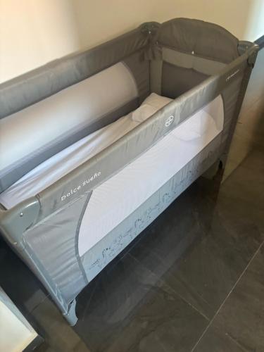 a metal bunk bed with white sheets on it at Chic Duplex Central 3 Suites et Wi-Fi in Marrakesh