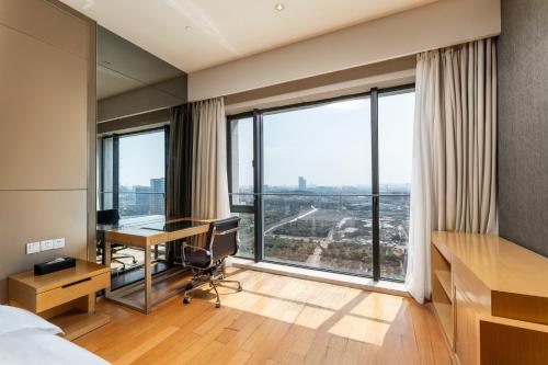 Fotografie z fotogalerie ubytování Snug Gaokong Jiangjing Hotel v Kantonu