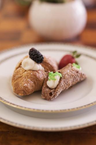 two pastries on a plate on a table at Le Porte del Tempo in Mazara del Vallo