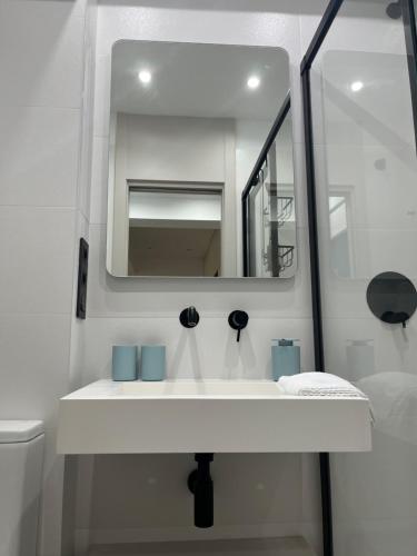 a bathroom with a white sink and a mirror at Marbella-abc-aparts in Marbella
