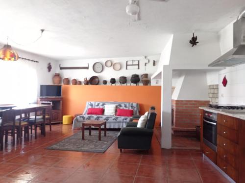 a living room with a couch and a table at Gerês e Cabreira - Casa Alexandrina Vilar in Frades