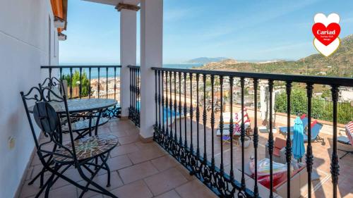 a balcony with a view of the ocean at Cariad Boutique Bed & Breakfast in Cala del Moral