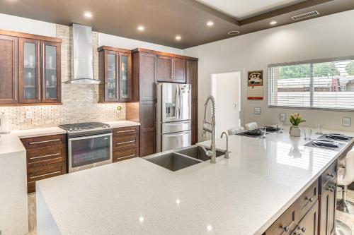 a kitchen with a large white counter top at Private Pool and Sauna Pet-Friendly Reseda Retreat! in Reseda