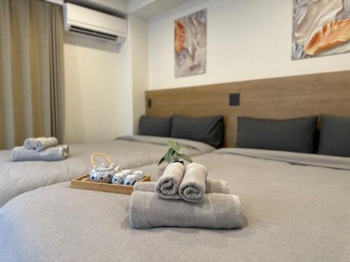 Postel nebo postele na pokoji v ubytování Akatsuki Iriya Hotel