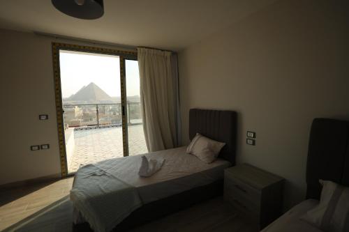 Cama o camas de una habitación en Legend Pyramids Inn