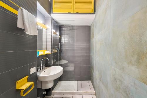 a small bathroom with a sink and a toilet at Terrazza Nico Seaview Terrace in Portovenere