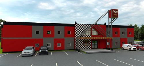 a red building with cars parked in a parking lot at Enzo Hotels 1er prix Dreux in Dreux