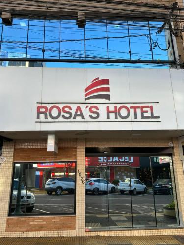 a rogas hotel sign on the front of a store at Rosa's Hotel in Toledo