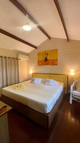 a bedroom with a large white bed in a room at Charming House in Albion with Shared Pool in Albion