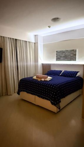 Ένα ή περισσότερα κρεβάτια σε δωμάτιο στο Alphaville Melhor localizaçao