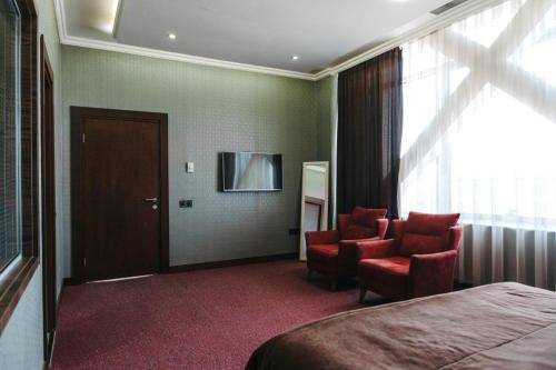 Μια τηλεόραση ή/και κέντρο ψυχαγωγίας στο Innab Inn Hotel