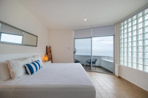 Ένα ή περισσότερα κρεβάτια σε δωμάτιο στο Suites Turquesa