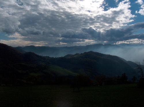 a view of a mountain range with clouds in the sky at Albergo Ristorante Panoramic in Zocca