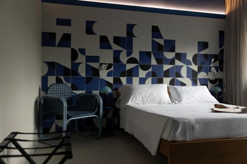 Letto o letti in una camera di MARITTIMO Milano Marittima