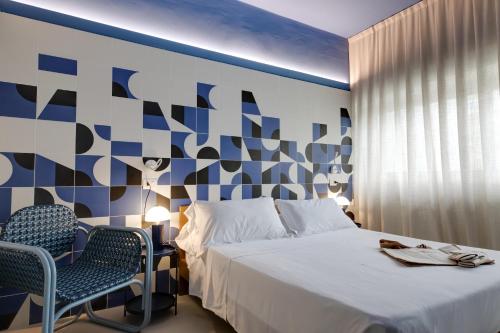 Letto o letti in una camera di MARITTIMO Milano Marittima