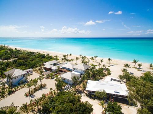 an aerial view of a resort on the beach at Beautifully Caribbean villa with captivating beach and clear blue waters in Leeward