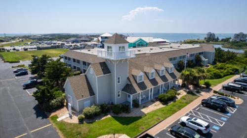 an aerial view of a building with a parking lot at Villas of Hatteras Landing by KEES Vacations in Hatteras