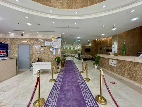 a purple carpet in a hotel lobby with a purple aisle at فندق صفوة المشاعر in Al Khansāk
