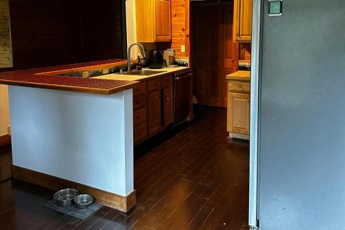 a kitchen with a sink and a counter top at Gstaad House in Girdwood