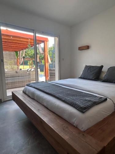 En eller flere senge i et værelse på Maison proche de la plage